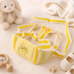 Toddler using baby walking harness for indoor support, soft padded waist in yellow