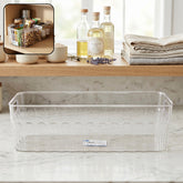 Transparent plastic fridge organizer basket with handles for easy lifting.