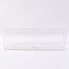 Decorative ribbed sides on a transparent storage basket for kitchen organization.