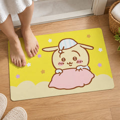 Two bare feet are placed on a yellow bath mat featuring a cartoon bunny snuggled under a pink blanket.