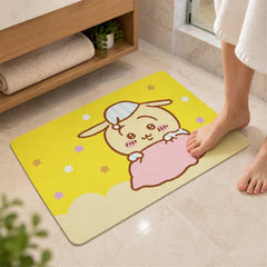 A close-up of a person's bare feet landing on the yellow bath mat with a cartoon bunny character.