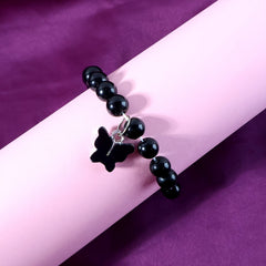Butterfly charm and elastic stretch band detail
