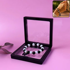 Elegant black and white fancy bracelet with cross pendant