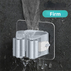 Wall-mounted rack clips holding multiple cleaning tools