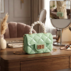 Elegant quilted mini handbag with pearl handle and chain strap