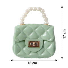 Compact quilted mini handbag showing front lock closure