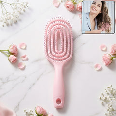 Pink curved vented detangling hair brush