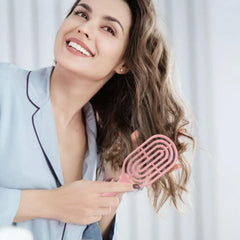 Close-up of flexible bristles on curved vented hair brush