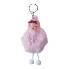 Hand holding the cute doll plush keychain with soft fur ball
