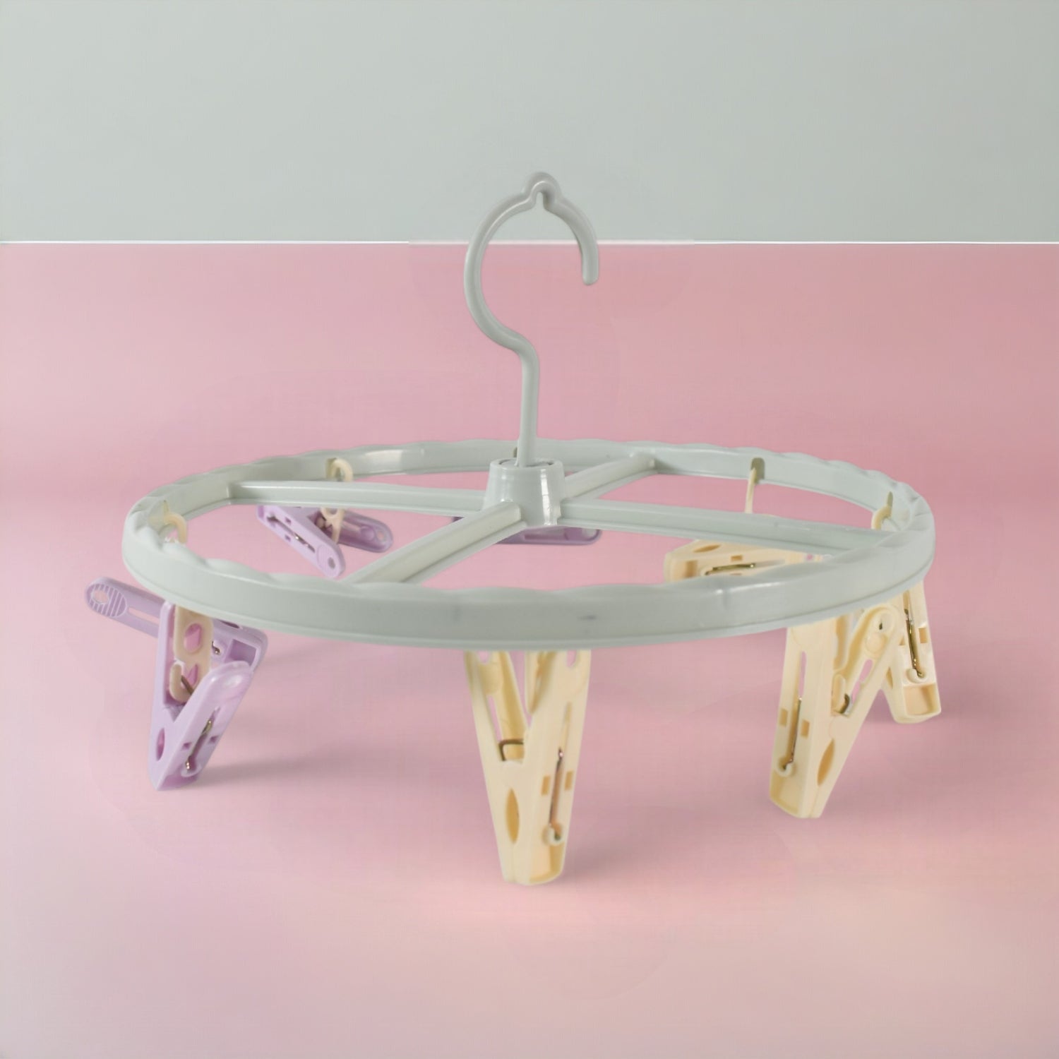 Clothespin rack with 8 clips hanging laundry items