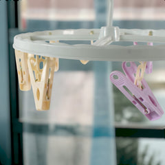 Close up of clips on clothespin drying rack