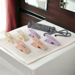 Clips on rope holding clothes firmly