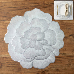 Round floral design PVC table mat on table
