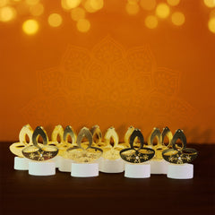 Close-up of golden diya shaped LED candle light
