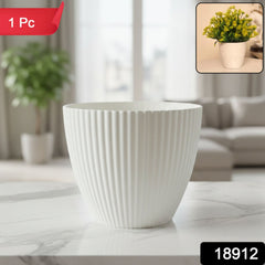 White ribbed plant pot showing texture
