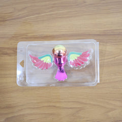 Dashboard bird figurine with wing motion