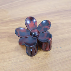 Side view of clutch-style flower hair clip