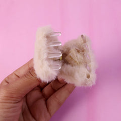 Side view of fluffy hair claw clip accessory