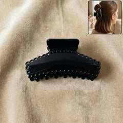 Elegant black hair claw clip holding hair securely