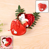 Heart shaped Valentine’s gift box with teddy bear and roses