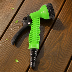 Close-up of garden hose spray nozzle trigger