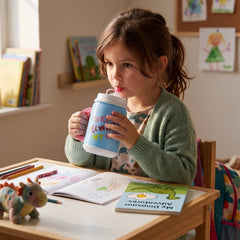 Close-up of insulated mug with built-in straw