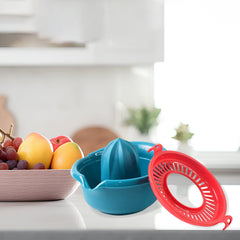 Handheld citrus juicer in use