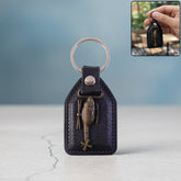 Premium leather finish keychain with metal sword emblem front view