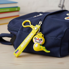 Cartoon dinosaur figure keychain showing detailed soft finish