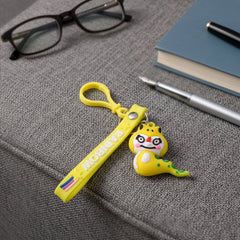 Dinosaur cartoon key ring with clip attached to a bag zipper