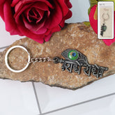 Radha Krishna Radhe Radhe metal keychain with peacock feather design