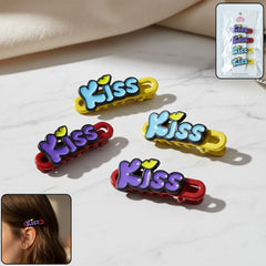 Four 'Kiss' text bar hair clips displayed