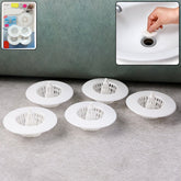 White plastic sink drain hair catcher filter