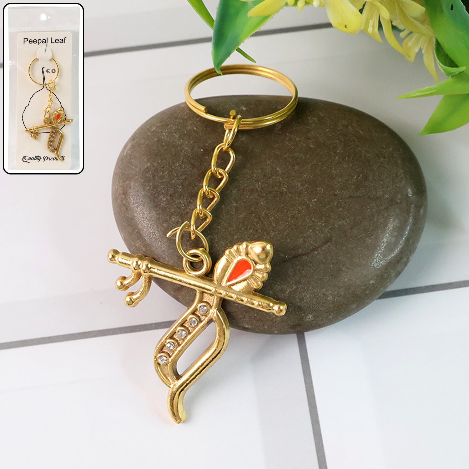 Flute and Peacock Feather Krishna metal keychain on white background