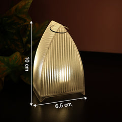 Warm glowing LED decorative candle light with transparent design