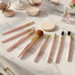 Close-up of various makeup brushes for eyes, face, & lips