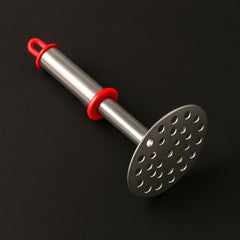 Close-up of wide mashing plate with holes on potato masher