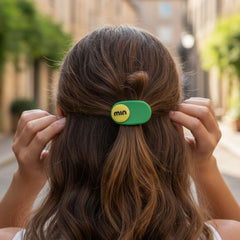 Single decorative hair clip with a text accent design