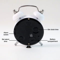 Twin-bell alarm clock on a bedside table
