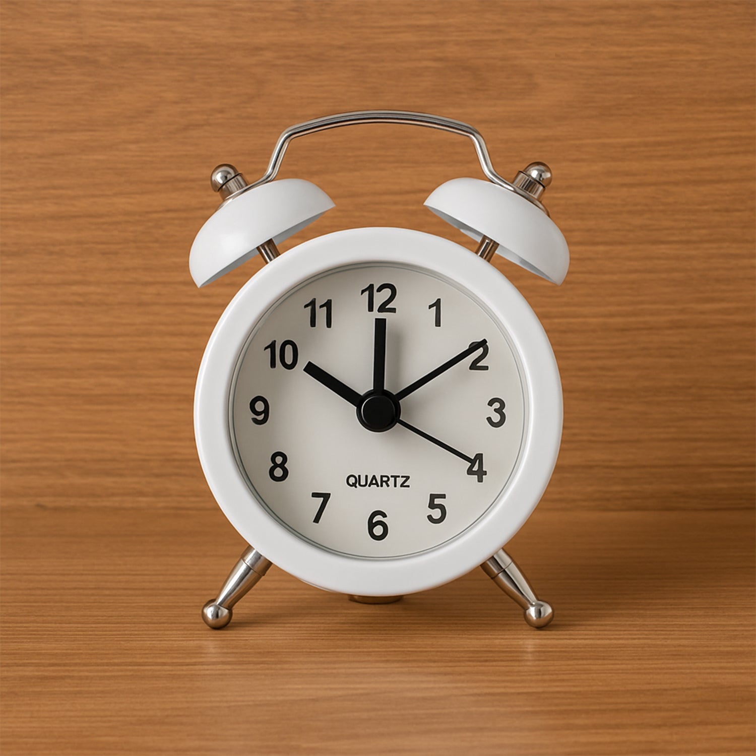 Small twin-bell analog alarm clock face