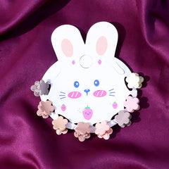 Close-up of colorful mini hair claw clips for kids