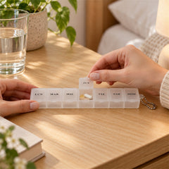 Medicine pill box with clear flip lids.