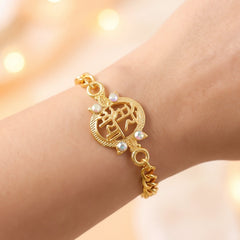 Gold-plated Mere Bhaiya rakhi worn as a stylish bracelet on a brother's wrist.