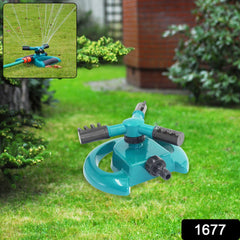 Garden 3-arm sprinkler connected to hose
