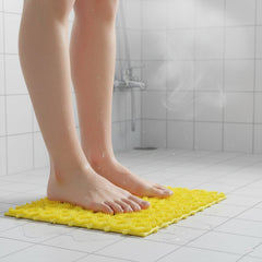 Bathroom mat placed securely on wet floor preventing slips