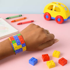 Snap slap bracelet wrapped around a wrist