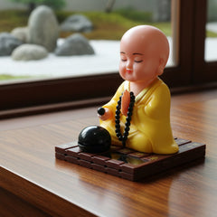 Solar Buddha statue with moving parts