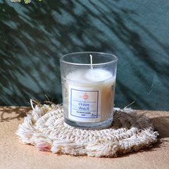 Decorative In'lief glass jar candle on table
