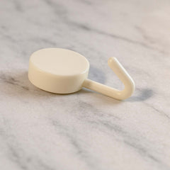 Stick-on round wall hooks mounted on wall