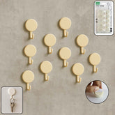 Set of 10 self adhesive round wall hooks on display